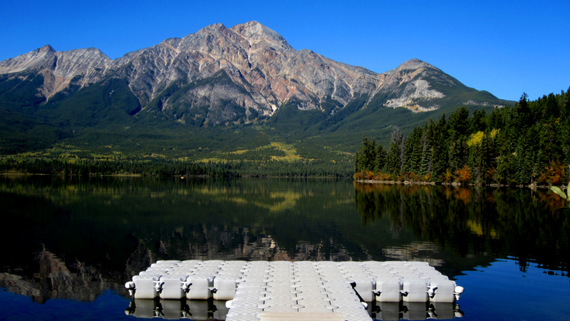 Pyramid Lake with white dock and mirror-calm water